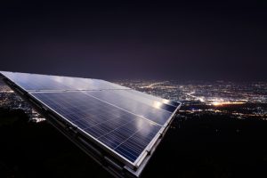rooftop solar panels at night