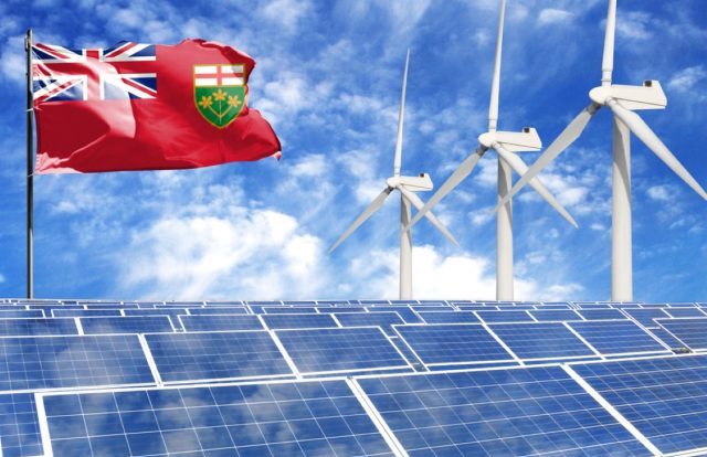 Solar panels on the background of a flagpole with the flag of Ontario and Wind Turbine